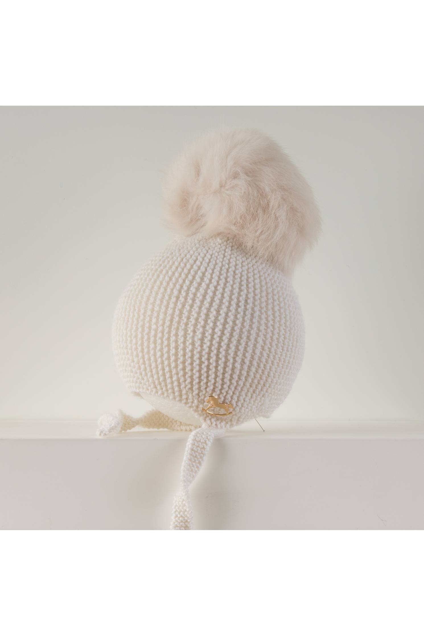 gorro aviador merino piedra con pompon rapado